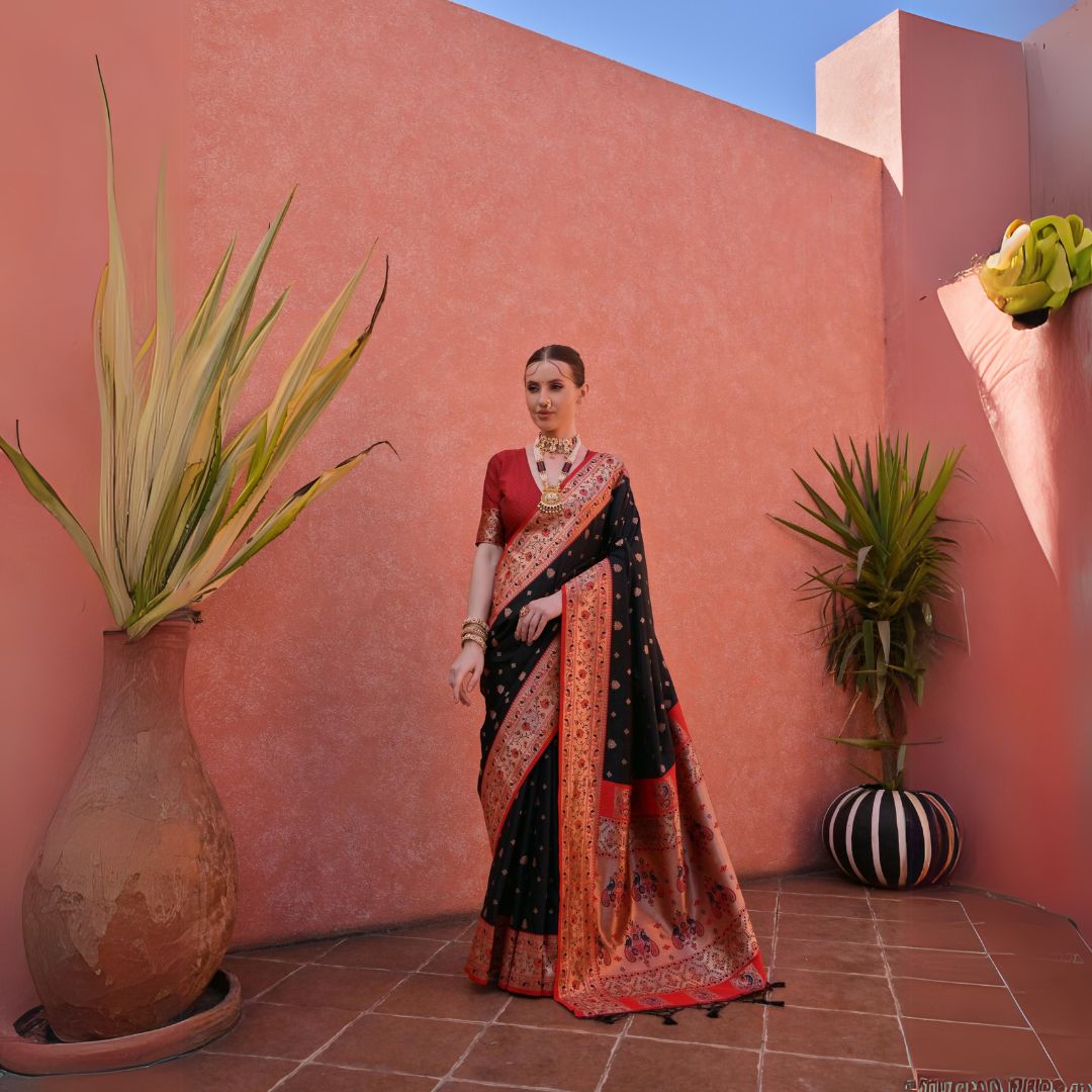 Elegant black silk saree with intricate zari woven pallu, perfect for festive occasions.