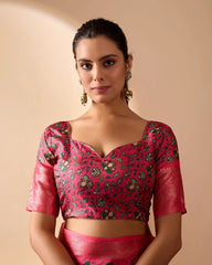 Woman wearing a pink traditional outfit with a floral blouse on a beige background