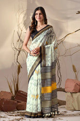 Woman wearing a traditional saree with a natural setting