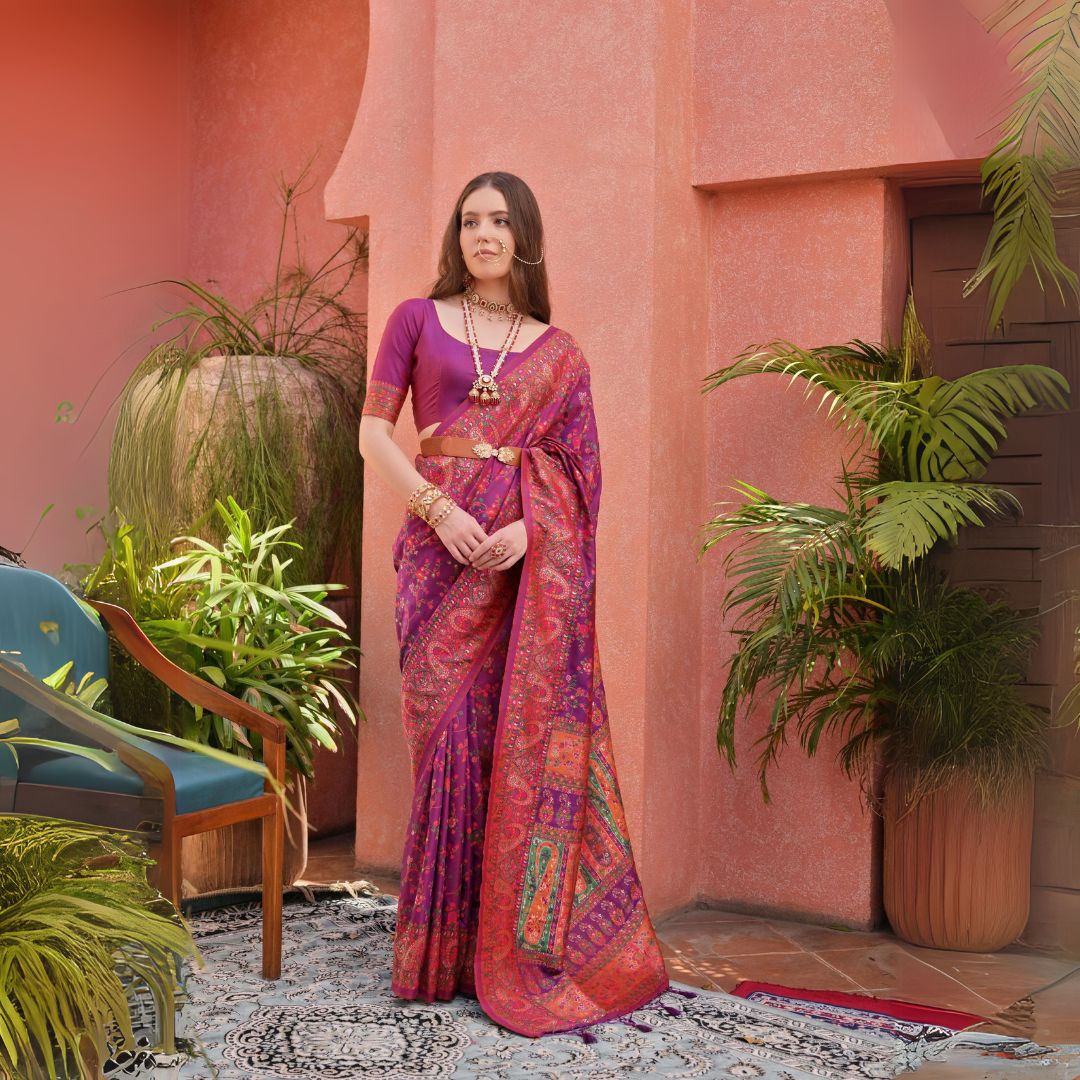 Woman in dark pink Kashmiri Jal weaving saree with rich ethnic patterns and classic Indian accessories