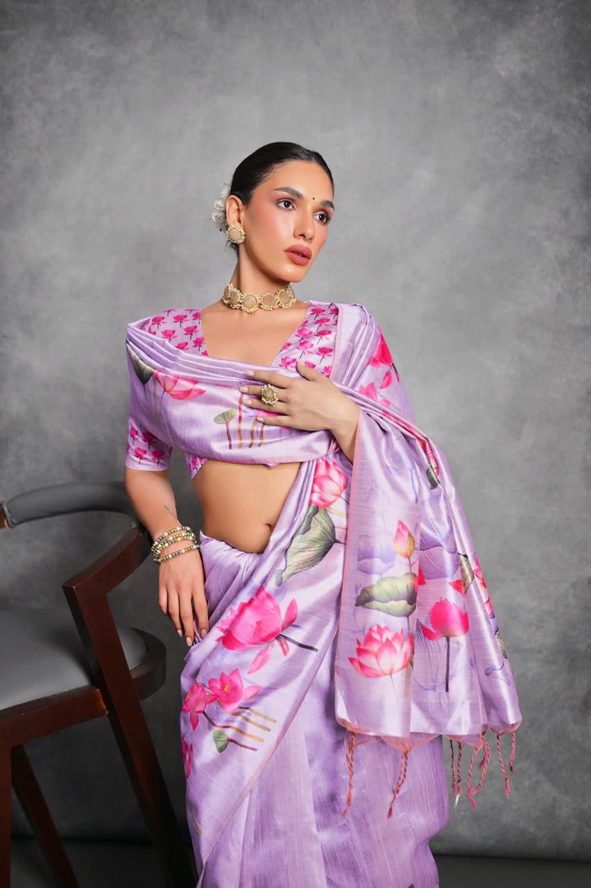 Woman wearing lavender floral printed saree standing outdoors in elegant traditional Indian ethnic