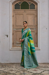 Green saree with Kadwa style weaving and multicolor stripes
