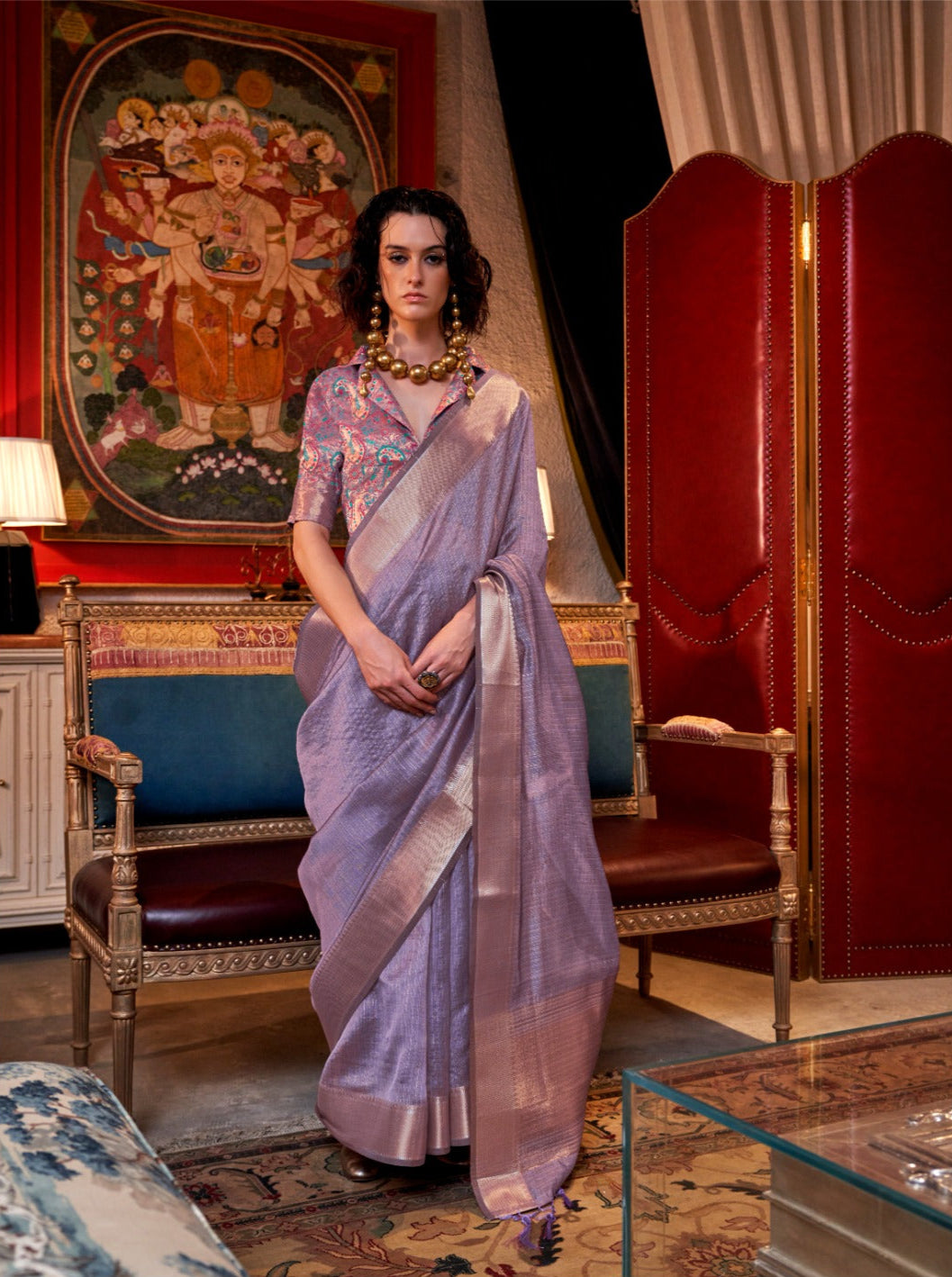 Lavender handloom saree with zari work, paired with a vibrant embroidered blouse, exuding ethnic grace and artisanal charm