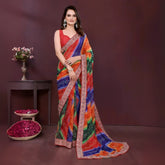 Woman wearing a colorful saree with a dark background