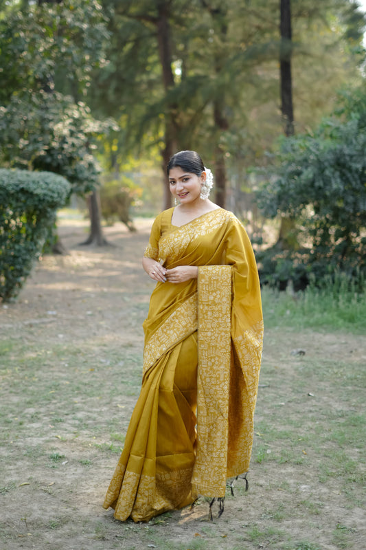 Mustard yellow saree with zari work outdoors