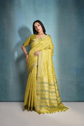 Pale yellow saree featuring intricate ikkat and zari weaving, showcasing traditional handloom textile craftsmanship