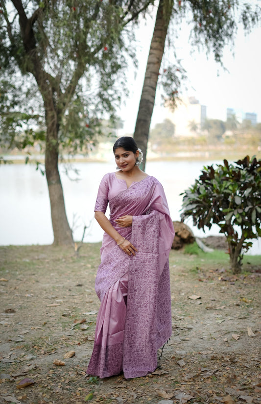Purple saree with zari work in an outdoor setting