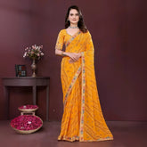 Woman wearing a yellow digital print saree with embroidery work and a contrast patterned border, paired with a matching blouse in an indoor studio product image