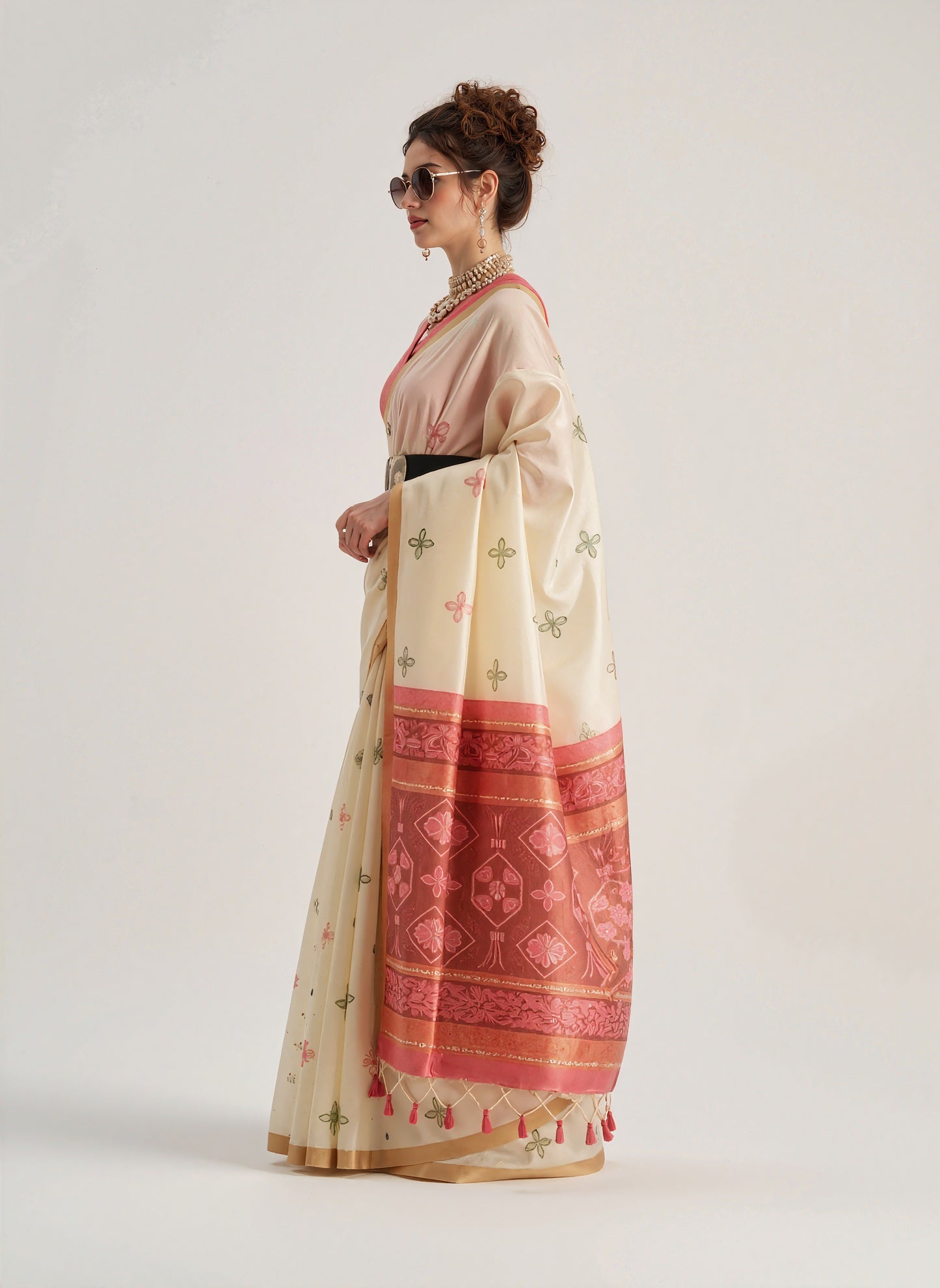 Beige Patola silk saree featuring traditional geometric and floral weaving patterns. Includes a matching blouse piece. Lightweight and elegant, ideal for festive and ceremonial occasions.