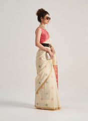 Beige Patola silk saree with intricate geometric and floral weaving patterns. Includes a matching blouse piece. Lightweight and elegant, ideal for festive and ceremonial occasions.