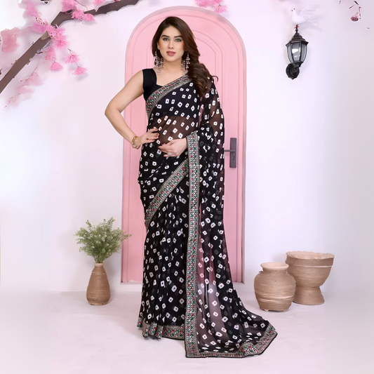 Woman wearing a vibrant pink bandhani saree with traditional white tie-dye patterns and a decorative embroidered border, paired with a sleeveless matching blouse. She stands gracefully in front of a pastel pink arched doorway, accessorized with statement earrings and bangles, surrounded by earthy clay pots, a small green foliage vase, and pink decorative branches in a contemporary minimalist studio setting.