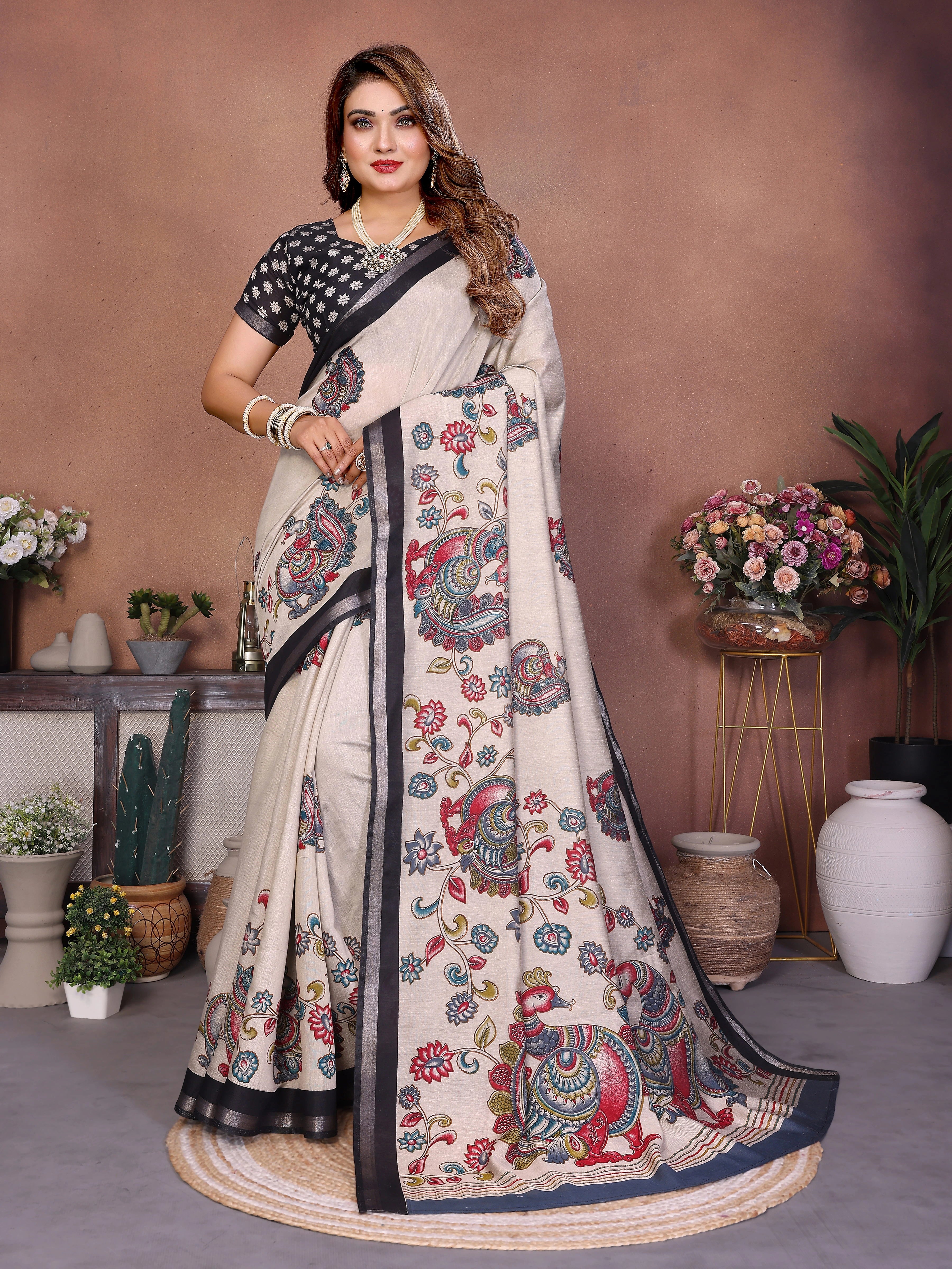 Woman wearing a floral saree with a neutral background