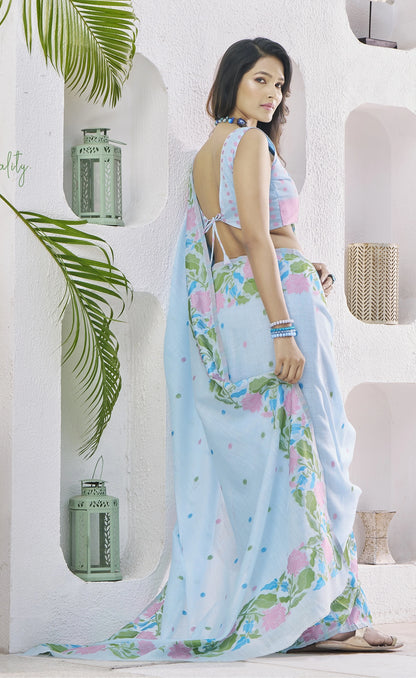 Woman wearing a floral saree in a bright interior setting
