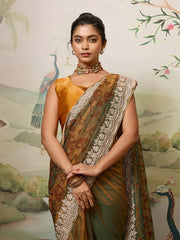 Woman in a traditional saree with a decorative background featuring peacocks.