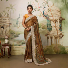 Woman in a traditional saree standing in front of an ornate wall mural with peacocks and architectural elements.