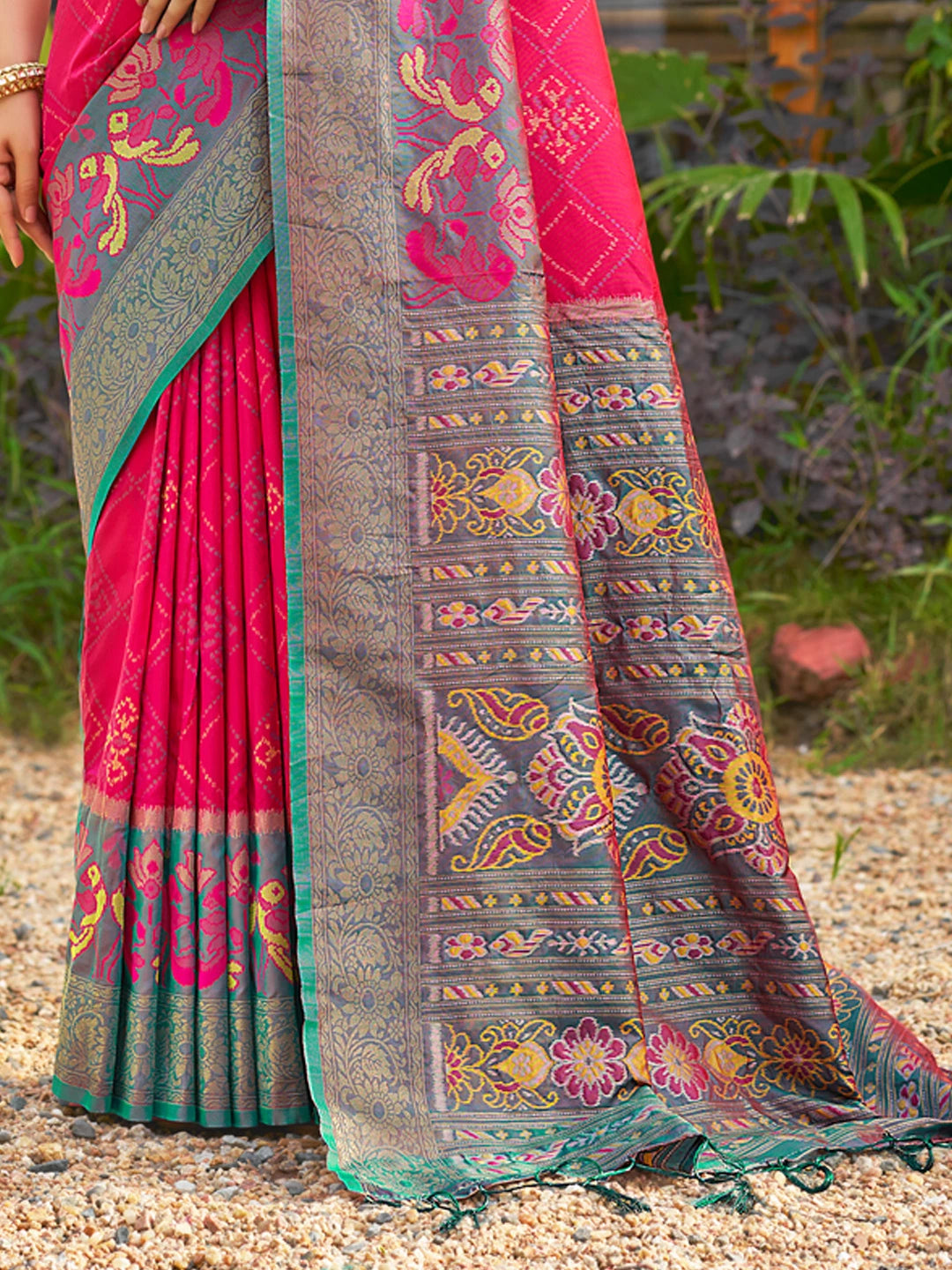 Traditional saree with intricate patterns on a natural background