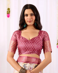 Woman wearing a pink blouse with a white floral pattern on a white background