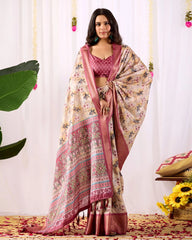 Woman wearing a traditional saree with a floral pattern against a white background