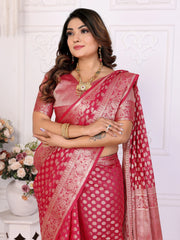 Woman wearing a red saree with a white pattern against a white background