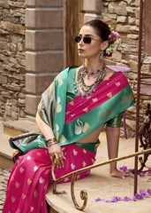 Woman in a colorful saree with jewelry sitting on steps.
