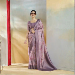 Woman wearing a purple saree with a blurred background
