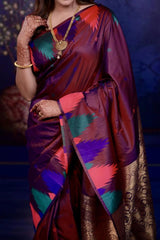 Woman wearing a colorful saree with a dark background