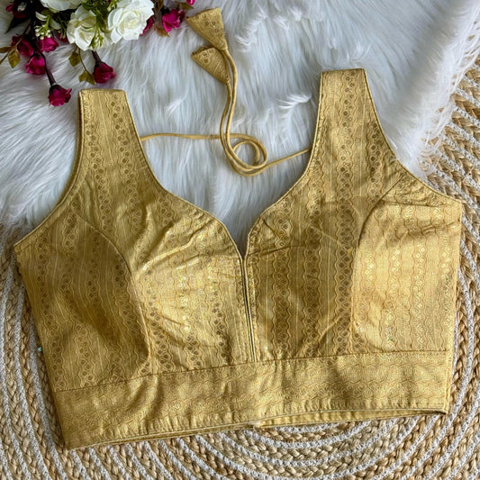 Elegant Pale Yellow Zari Work Silk Blouse featuring intricate embroidery, perfect for festive and traditional occasions.