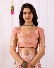 Woman wearing a pink blouse with floral patterns on a white background