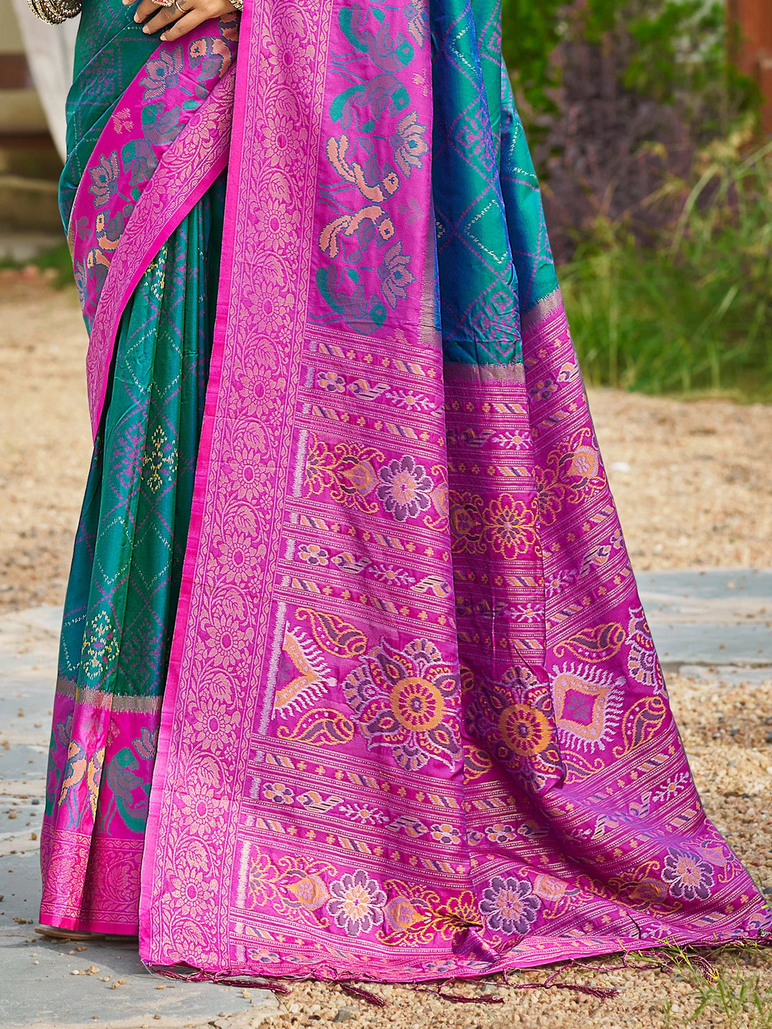 Colorful saree with intricate patterns on a natural background