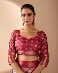 Woman wearing a red floral blouse with a beige background