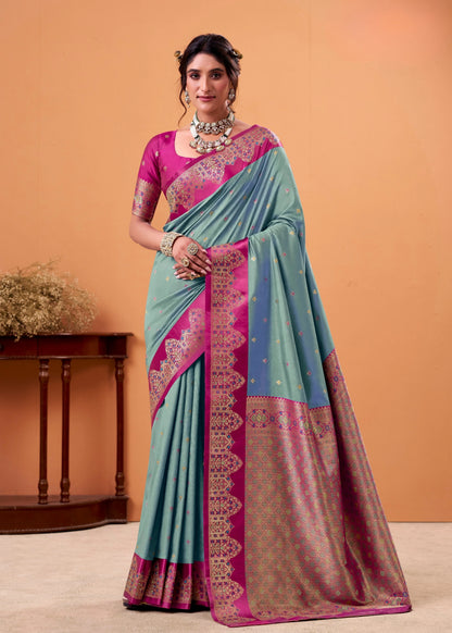 Woman wearing a traditional saree with a pink blouse against an orange background