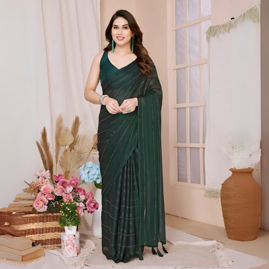 Woman wearing a dark green saree with subtle sequin stripes and a sleeveless blouse, accessorized with green earrings and a bracelet, standing in a modern interior decorated with pink and blue flowers, dried foliage, wicker baskets, and a large terracotta pot.

Related
File name: modern-office-workspace
Alt text: Bright and organized modern office workspace with a computer and plants.