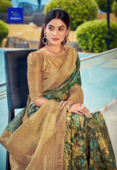 Woman in a dark green zari work saree featuring elegant floral design and rich golden border, posing gracefully by the poolside in ethnic jewelry