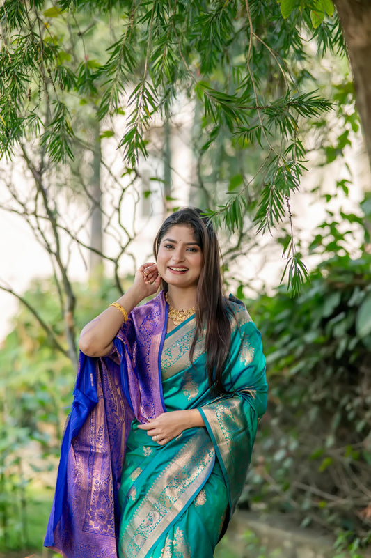 Deep teal saree with zari work and contrasting purple pallu