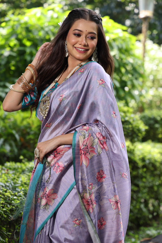 Woman wearing lavender floral print saree posing outdoors in graceful traditional Indian attire