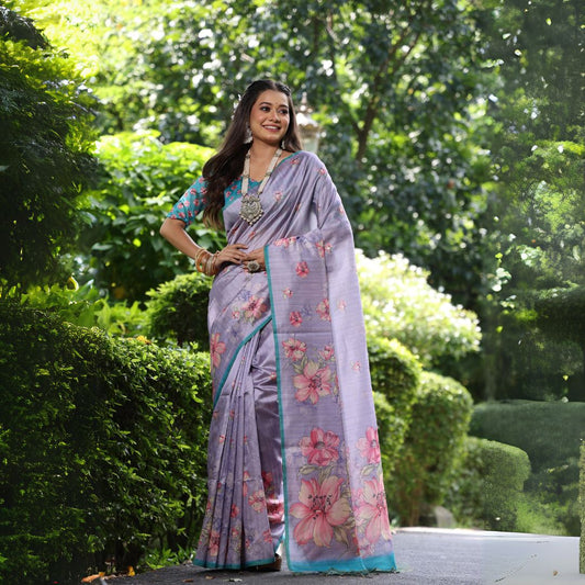Woman wearing lavender floral print saree posing outdoors in graceful traditional Indian attire