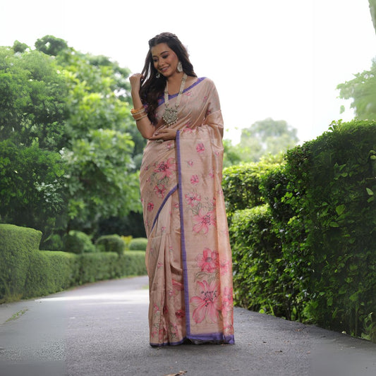 Woman wearing light beige floral print saree posing outdoors in traditional Indian ethnic attire