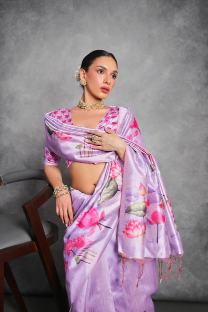 Woman wearing lavender floral printed saree standing outdoors in elegant traditional Indian ethnic