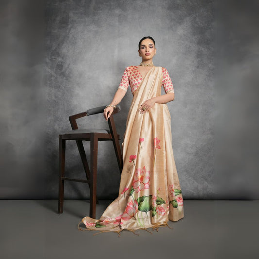 Woman wearing yellowish beige floral printed saree standing outdoors in elegant traditional Indian ethnic attire