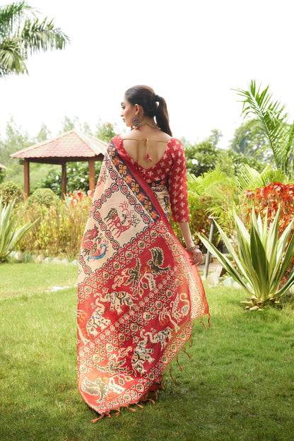Light beige saree with Patola print seen from behind outdoors