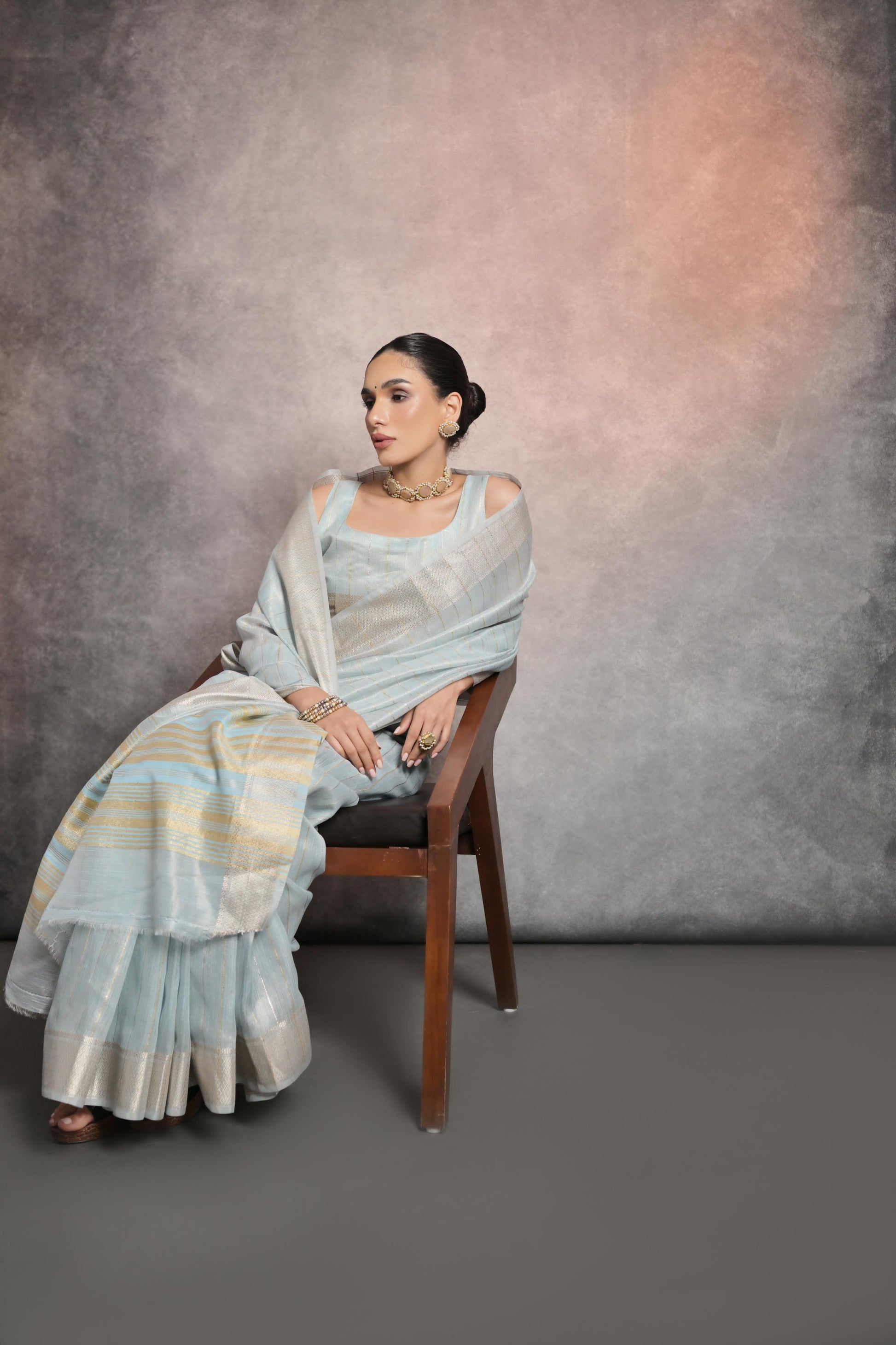 Sophisticated light gray saree crafted in smooth rangoli silk fabric