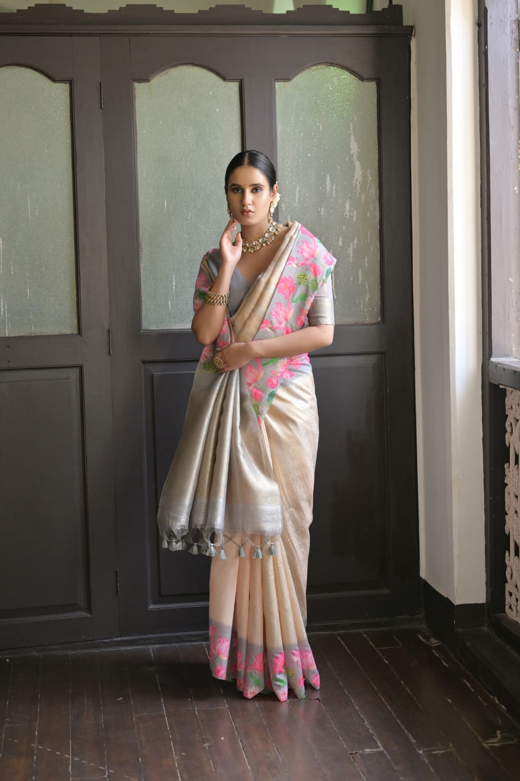 Elegant light gray saree with intricate zari work design