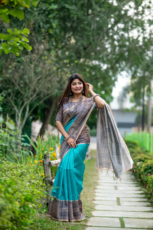 Teal Madhubani print saree with intricate traditional Indian artwork and ethnic detailing