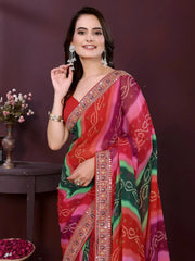 Woman wearing a colorful saree with a dark background