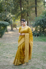 Mustard yellow saree with zari work outdoors