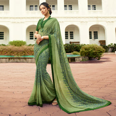 Woman in an olivine jacquard work saree with gold border standing indoors in an elegant room with arched decor and vintage furniture elements