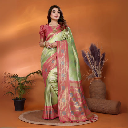 Model wearing a pista green and pink Paithani woven saree with traditional motifs and a contrast border, paired with a matching blouse in an indoor studio product image, Indian ethnic wear