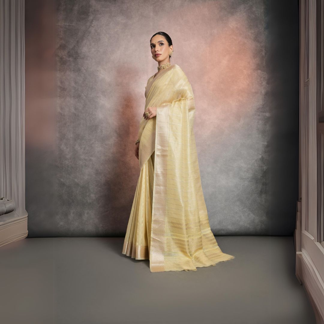 Elegant pale yellow saree made from soft and lustrous rangoli silk fabric