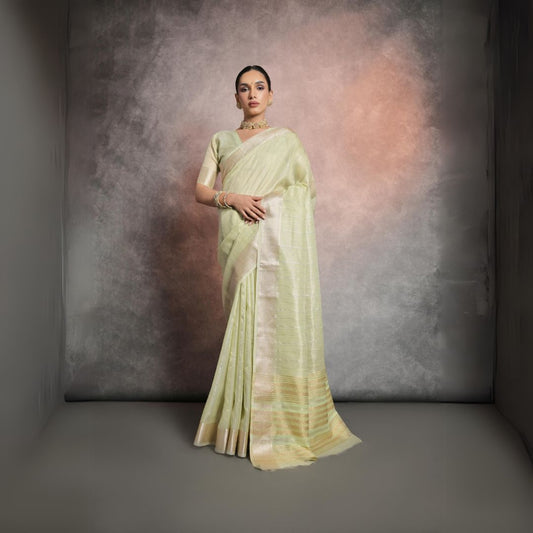 Graceful pastel pistachio green saree crafted from premium rangoli silk fabric