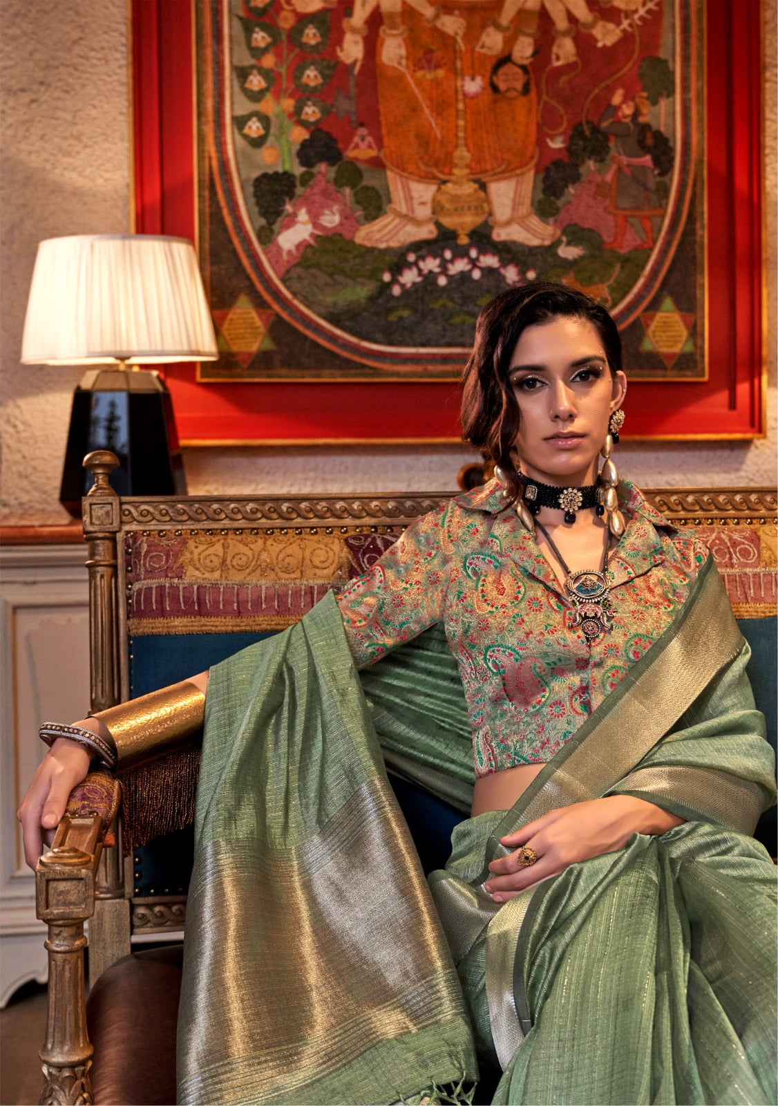 Pastel sea green zari work handloom saree styled with an embroidered designer blouse, showcasing traditional elegance and intricate craftsmanship
